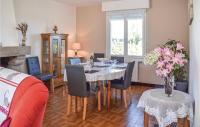 a dining room with a table and chairs at Stunning Home In Kerbors With House Sea View in Kerbors