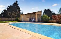 a swimming pool in front of a house at Beautiful Home In Mornas With 4 Bedrooms, Private Swimming Pool And Outdoor Swimming Pool in Mornas