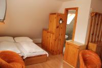 A bed or beds in a room at Penzión U Johna