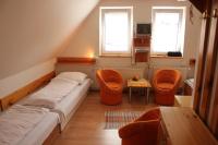 A bed or beds in a room at Penzión U Johna