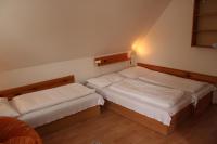 A bed or beds in a room at Penzión U Johna