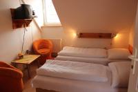 A bed or beds in a room at Penzión U Johna