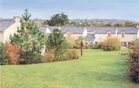 a group of houses with trees in a yard at Le Hameau De Peemor Pen in Morgat