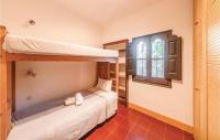 A bed or beds in a room at Cozy Home In Tossa De Mar With Wifi