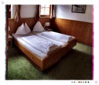 Łóżko lub łóżka w pokoju w obiekcie Hotel St. Florian - Kaprun