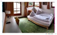 Łóżko lub łóżka w pokoju w obiekcie Hotel St. Florian - Kaprun