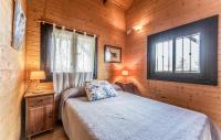 A bed or beds in a room at El Collado