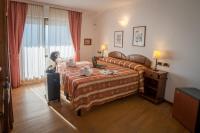 Łóżko lub łóżka w pokoju w obiekcie HG Hotel Italia