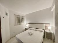 A bed or beds in a room at APARTMENT IN BENIDORM CITY CENTER