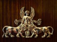 a gold statuette of an angel riding a horse at Hôtel de Varenne in Paris