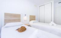 A bed or beds in a room at 3 Bedroom Cozy Apartment In Denia