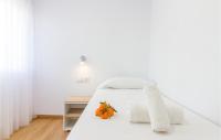 A bed or beds in a room at 3 Bedroom Cozy Apartment In Denia