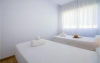 A bed or beds in a room at 3 Bedroom Cozy Apartment In Denia