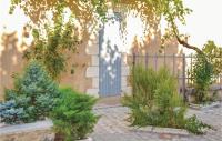 a house with a blue door and some plants at Stunning Home In Sainte Alvre With 6 Bedrooms, Sauna And Private Swimming Pool in Saint-Alvère