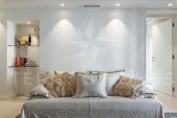 a white room with a couch with pillows on it at Paula by Terry&#39;s Homes in Cannes