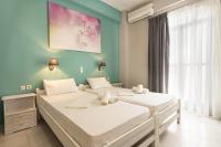 Posteľ alebo postele v izbe v ubytovaní Protopapas Rooms
