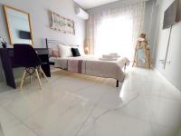 A bed or beds in a room at DriftWood Center Apartment