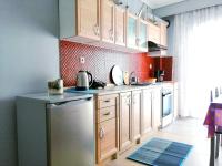 A kitchen or kitchenette at DriftWood Center Apartment