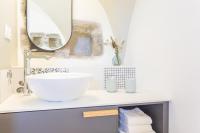 a bathroom with a sink and a mirror at Les Tours Carrées in La Motte-Servolex