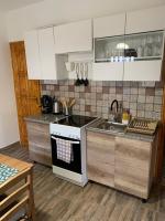 A kitchen or kitchenette at Mátrai Vadászház 3-Vintage Cottage