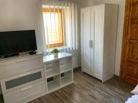 A television and/or entertainment centre at Mátrai Vadászház 3-Vintage Cottage