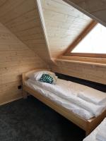 Posteľ alebo postele v izbe v ubytovaní Apartament Jeleń Łoś Niedźwiedź