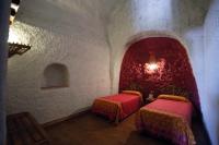 Postel nebo postele na pokoji v ubytování Casas Cueva y Cortijo La Tala en Guadix