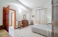 A bed or beds in a room at Mimosa