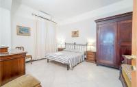 A bed or beds in a room at Mimosa