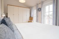 Postel nebo postele na pokoji v ubytování Ferienwohnung Strandgut Sonnenseite