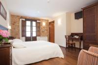 Postel nebo postele na pokoji v ubytování Hotel Rural El Fundil
