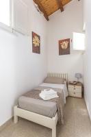 A bed or beds in a room at Salomone Apartments II by Wonderful Italy