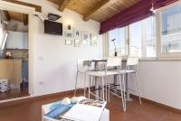 A kitchen or kitchenette at Salomone Apartments II by Wonderful Italy