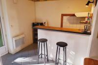 a kitchen with two bar stools at a counter at STUDIO of 24m with small patio in Avignon