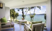 a living room with a view of the ocean at Amari Phuket in Patong Beach