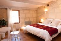 Een bed of bedden in een kamer bij La Maison d&#39;Eloise