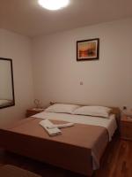 Postel nebo postele na pokoji v ubytování Apartments Grozdana