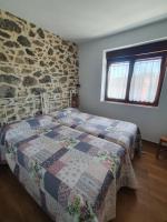 A bed or beds in a room at CASTRO - LA COLINA