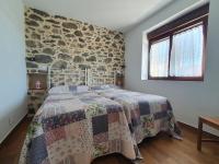 A bed or beds in a room at CASTRO - LA COLINA