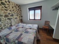 A bed or beds in a room at CASTRO - LA COLINA