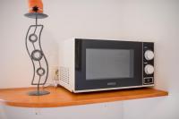 Televízia a/alebo spoločenská miestnosť v ubytovaní Apartment Marisol Barbat