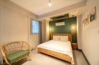 Postel nebo postele na pokoji v ubytování Reddoors Suites Sea View