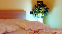 A bed or beds in a room at Affittacamere La Martina