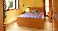 A bed or beds in a room at Affittacamere La Martina