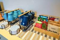 a kitchen counter with blue pitchers and a box of food at 東風雅舍 in Hualien City