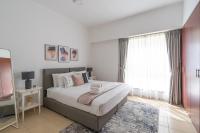 Postel nebo postele na pokoji v ubytování HiGuests - Stylish Apartment in JBR Steps From the Beach