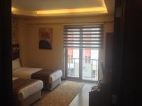 A bed or beds in a room at My Liva Hotel