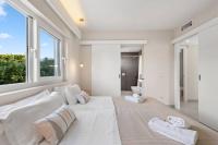A bed or beds in a room at Villa Binixiqui