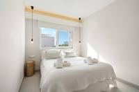 A bed or beds in a room at Villa Binixiqui