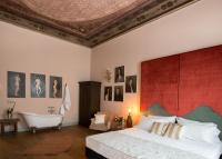A bed or beds in a room at Soprarno Suites